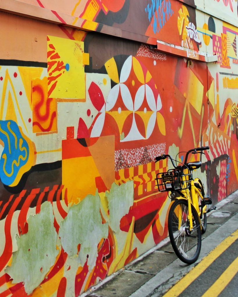 street art graffiti  singapore yellow and black bike