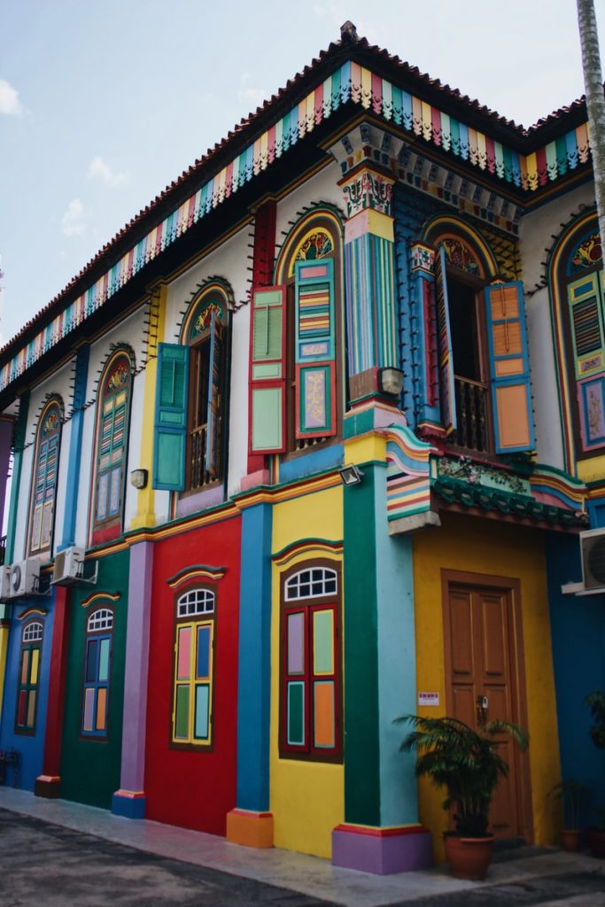  colorful houses in Singapore multicolored concrete buildings under blue skies