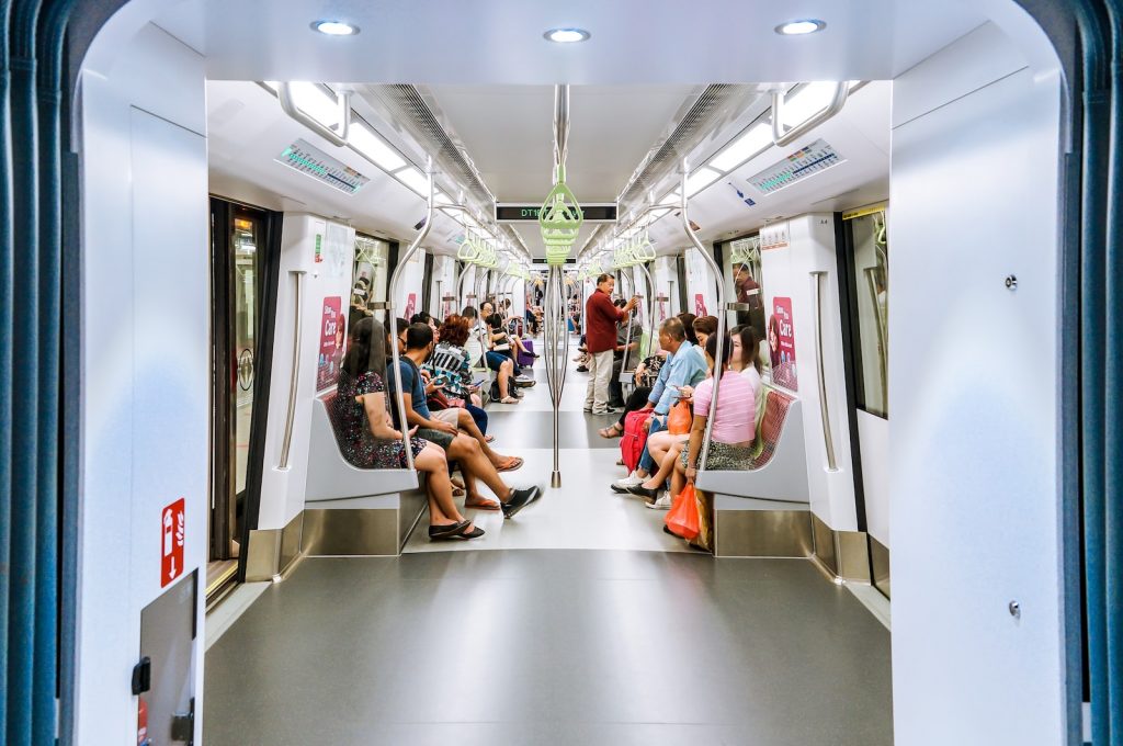 people sitting on train seat singapore